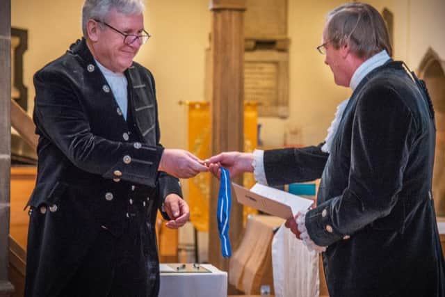 Paul Callaghan receives his badge of office from outgoing High Sheriff Lt Gen Robin Vaughan Brims. Picture by David Allan.