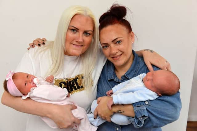Kelly Pemberton with baby Anais Pemberton and sister Tanya Beatie with baby  Buddy Beatie (R) gave birth within twenty minutes of each other.