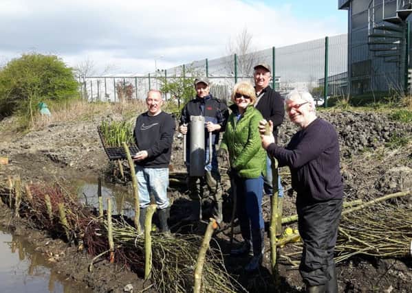 At Wapping Burn are, from left, Wear Rivers Trust secretary Neil Ashforth, local volunteer William Wilkinson, Sandra Wardle from Novus Business Centre , Jim Wood from Caterpillar, and local volunteer Gary Smith helping out with the final day wetland planting task.