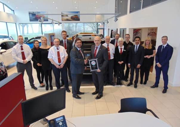 The team at Evans Halshaw Vauxhall Peterlee receive their awards.