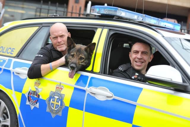 Police Interceptors Ian Squire and Mike "Spike" Fisher, with police dog Kaizer.