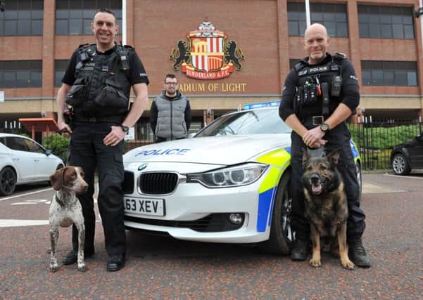 Police Interceptors Mike "Spike" Fisher (left) and Ian Squire , with police dogs Lottie and Kaizer, and event organiser David Barker.