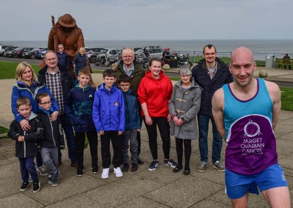 Scott Baker is welcomed by family and friends at the halfway mark of his 1000th 10K run on consecutive days,  at the Tommy statue, Seaham on Saturday.