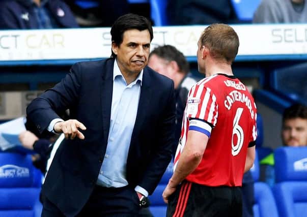 Boss Chris Coleman speaks to Lee Cattermole during Saturday's draw at Reading. Picture by Frank Reid