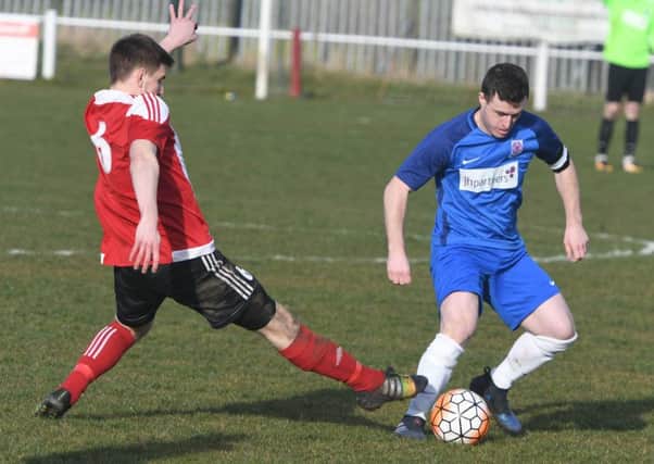 Seaham Red Star (blue) battle against Sunderland RCA in their recent clash at Meadow Park.