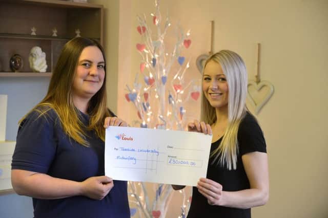 4Louis founder Kirsty McGurrell donation to Laura Clark (R) to study midwifery.