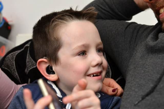 Joseph Gibson, five, was bought new radio aids by his school.