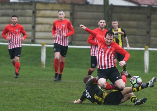 Silksworth CW (red/white) battle to victory against high-flying Hebburn Town Reserves two weeks ago. Picture by Kevin Brady