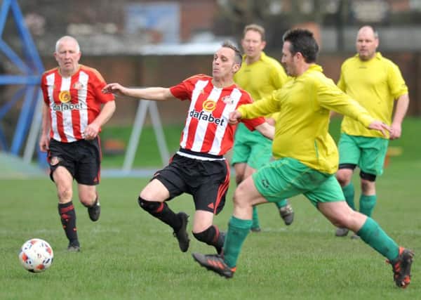 Mill View SC (red/white) take on Darsley Park at Thompson Park last weekend. Picture by Tim Richardson