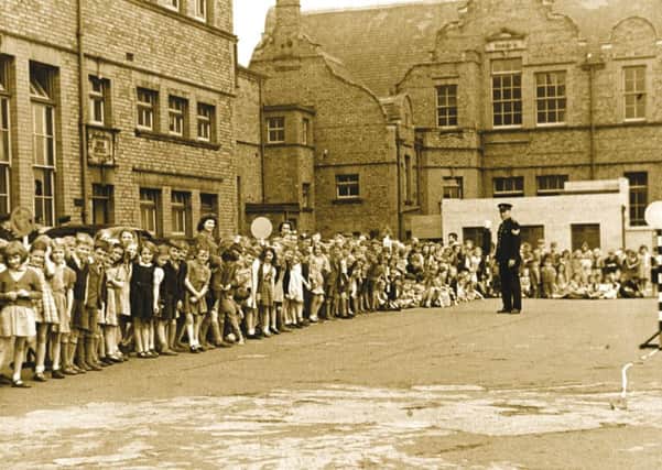 A photo from the book showing a road safety demonstration at Redby School in the 1940s.