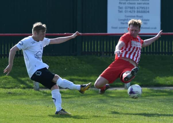 Seaham Red Star (red/white) defend against West Auckland on Saturday. Picture by Kevin Brady