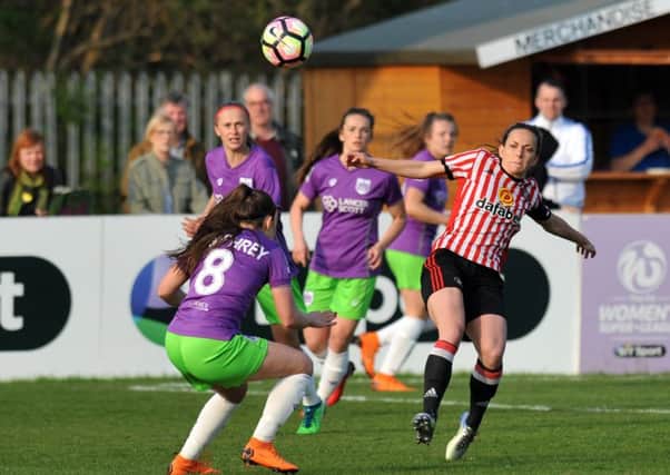 Sunderland Ladies' Lucy Staniforth (red/white) battles against Bristol City at Mariners Park on Saturday. Picture by Tim Richardson