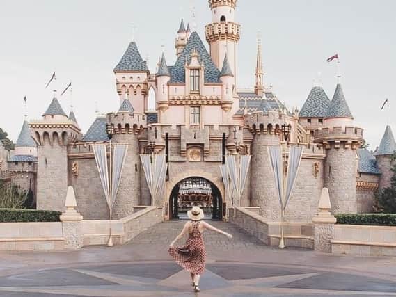 The photoshopped picture of Carolyn Stritch outside of Sleeping Beauty's Castle.