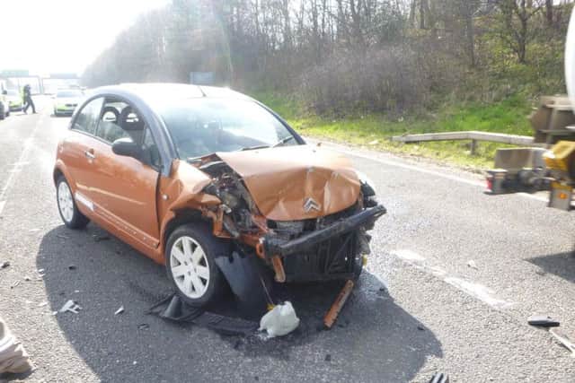 A badly damaged Citroen at a crash scene.
