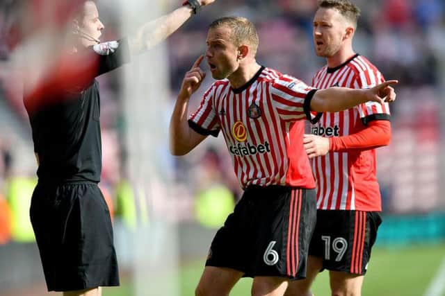 Lee Cattermole faces the assistant referee after a late goal is ruled out.