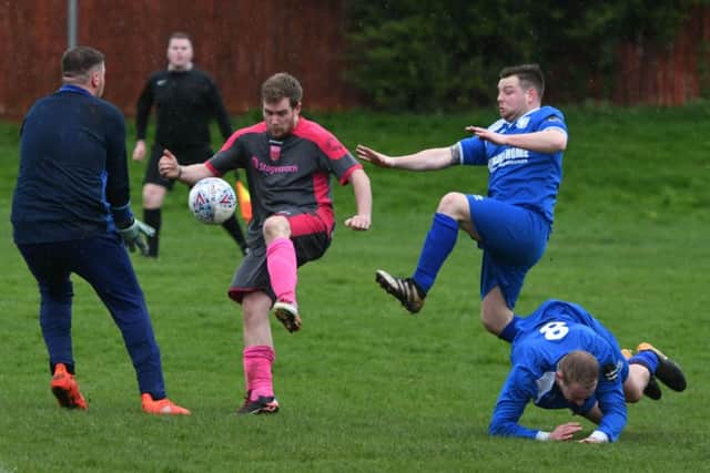 Pennywell Comrades (grey/pink) take on Herrington CW in the Sunderland Sunday League last weekend. Picture by Kevin Brady