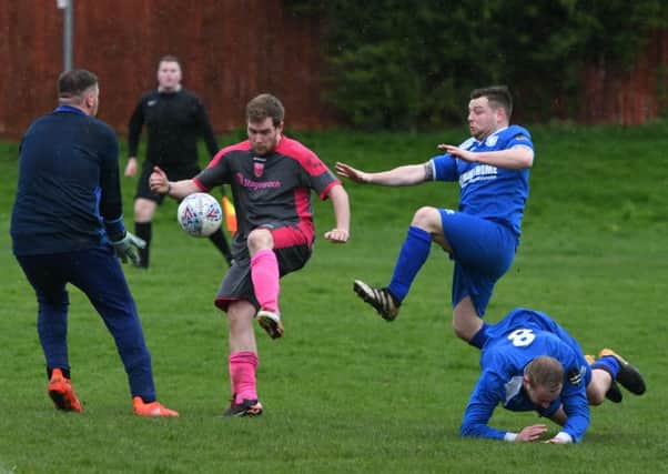 Pennywell Comrades (grey/pink) take on Herrington CW in the Sunderland Sunday League last weekend. Picture by Kevin Brady