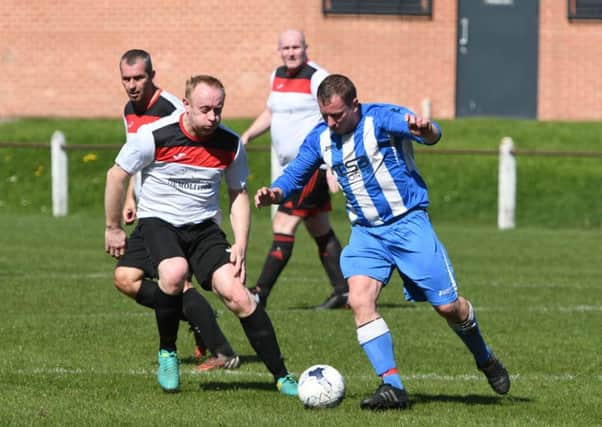 Over-40s action as Redhouse WMC (white) take on Hartlepool Workies last weekend. Picture by Tim Richardson