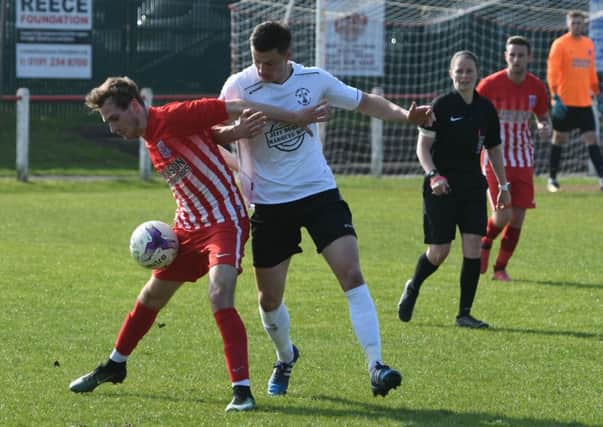 Seaham Red Star (red/white) fight against West Auckland in Division One last week. Picture by Kevin Brady