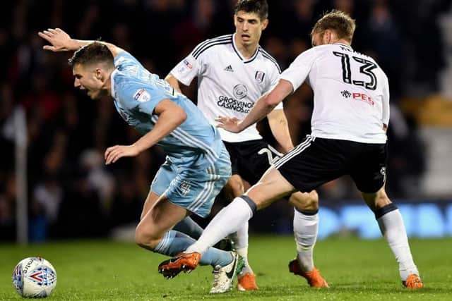 Paddy McNair goes down under Tim Ream's challenge. Picture by Frank Reid