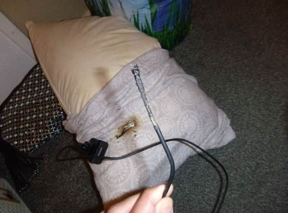 The frayed charger lead which sparked the fire.