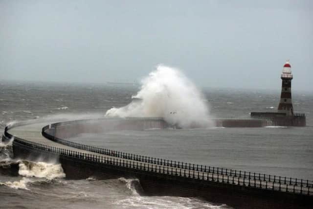 Roker Pier takes a battering during stormy weather.