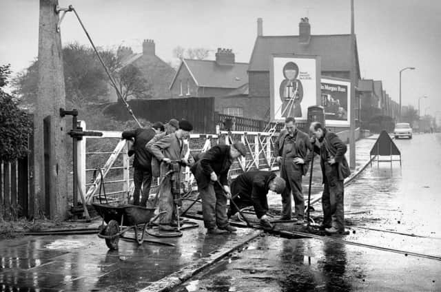 Fulwell crossing - train lines being taken up  October 1966 old ref number 34 4397
Men at work on the old Fulwell crossing once part of the Borough boundary, removing the railway track along which the last mineral train from the docks to the main line ran some years ago. see Tuesday October 25 1966