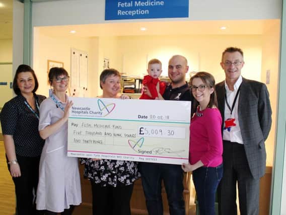 Ruth and Ross Elder present a cheque for 5,000 to the fetal medicine Team at the Newcastle Hospitals.