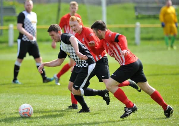Boldon CA (black/white) battle to victory against Silksworth CW on Saturday. Picture by Tim Richardson