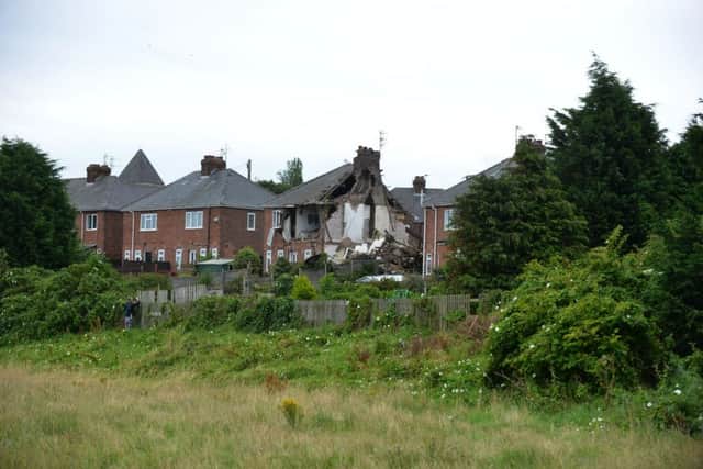 What remained of the semi-detached homes following the incident.