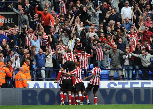 Sunderland fans celebrate wildly after a Zat Knight own goal clinched a 2-1 win at Bolton in 2011.