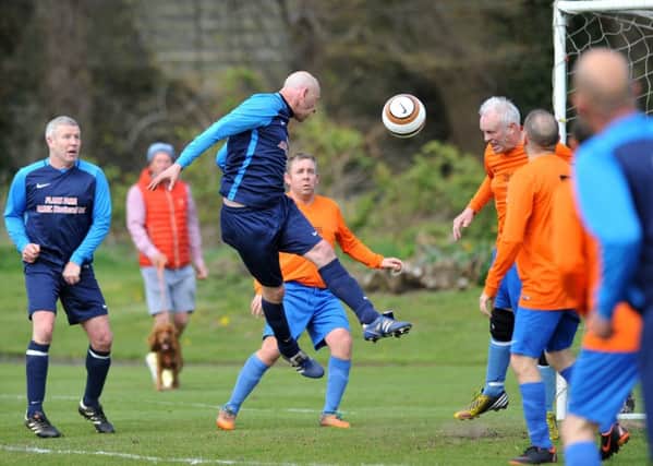 Plains Farm Alldec (blue) threaten against South Shields Catholic Club in the Over-40s League's Ironside Cup final last week. Picture by Tim Richardson