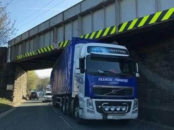 A lorry has become wedged under a bridge in Langley Moor near Durham City.