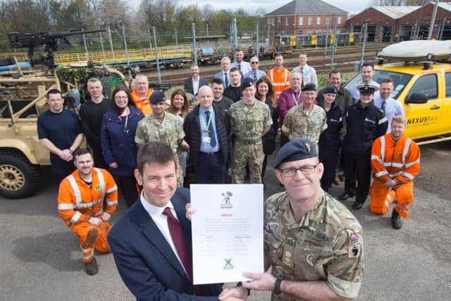 Signing the covenant is the Managing Director of Nexus Tobyn Hughes and Lt Col Andrew Black of the 4th Infantry Brigade.