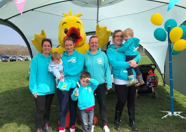 Julie Dugdale and Kimberley Porter-Brannon from Puddle Ducks North East and Alison Abbott and Melissa Unsworth from Puddle Ducks Tees Valley with their children Alex, Oliver and baby Max