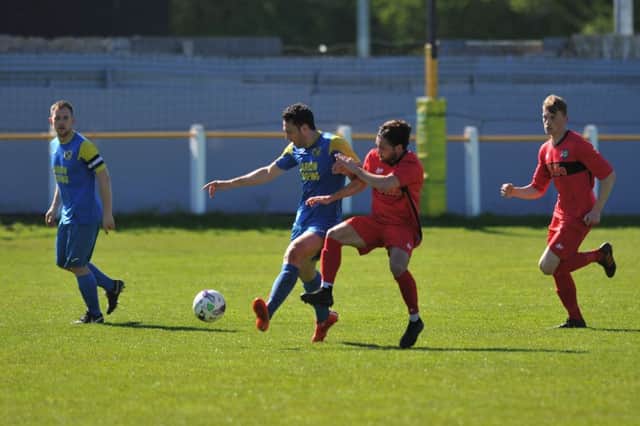 Jarrow Roofing (blue) take on Stockton Town in their last ever match at Boldon on Saturday. Picture by Tim Richardson