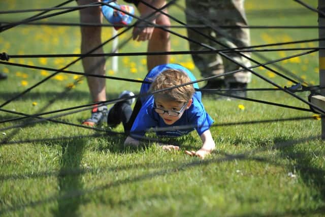 A  youngster tackles the bungee web in the event.
