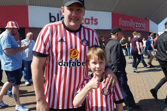 Steven Waddleton, left, attended Sunday's game with son Oscar, six.