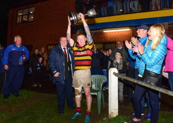 Sunderland RFC captain Joe Arrowsmith lifts the Durham County Junior Cup last night. Picture by Kevin Brady