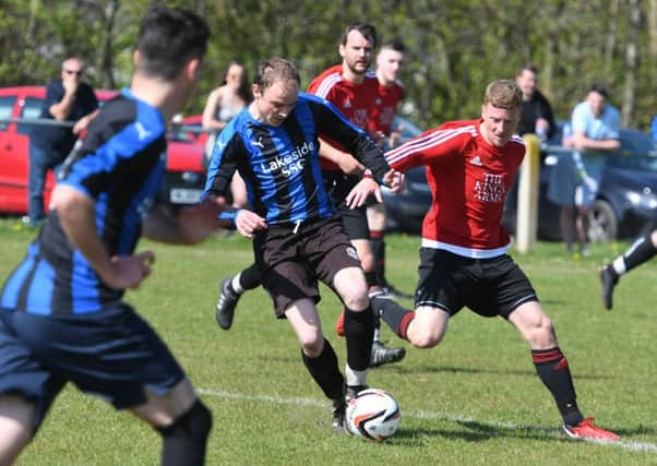 Lakeside (blue/black) take on Kings Arms (red) in last week's Sunderland Sunday League Third Division Subsidiary Cup final. Picture by Kevin Brady