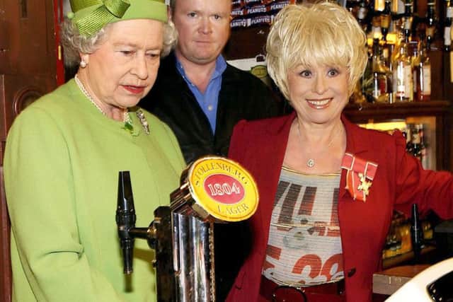Barbara Windsor pictured with the Queen during a royal visit to the EastEnders set.