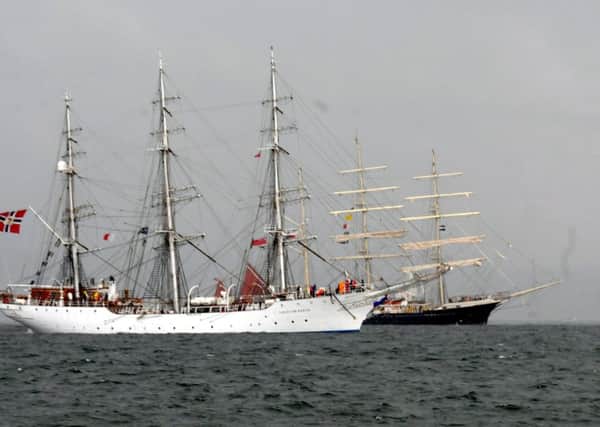 The Tall Ships Parade of Sail at sea.