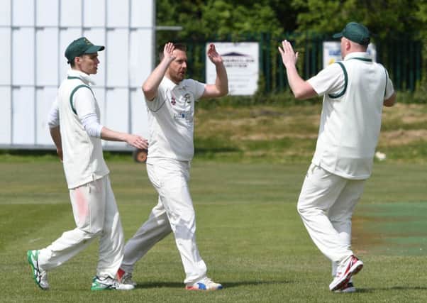 Easington bowler Gary Ward (second left) celebrates taking the wicket of Seaham Park opener Chris Allan on Saturday. Picture by Kevin Brady.