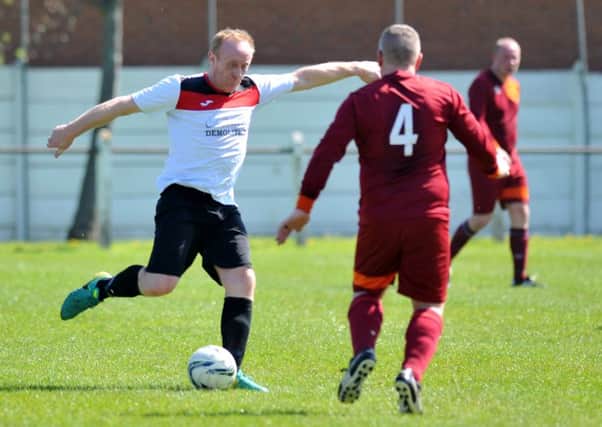 Redhouse WMC (white) take on Easington Colliery CIU in the Over-40s League last weekend.