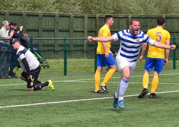 Chester-le-Street's Andrew Clarkson celebrates after opening the scoring against Ryton & Crawcrook Albion in the Ernest Armstrong Memorial Cup final at Consett. Pic: Gary Welford.
