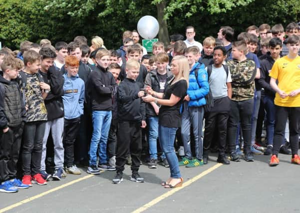 Balloons with messages of remembrance are released at St Aidan's Catholic Academy