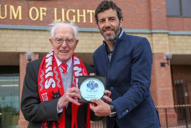 SAFC legend Julio Arca presents tickets for this month's FA Cup final between Chelsea and Manchester United to veteran Sunderland fan George Forster. Picture by Tom Banks
