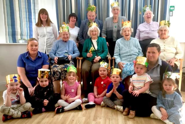 Residents of Glenholme House with staff and children from Busy Bees nursery.