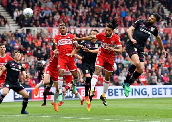 Mile Jedinak (right) glances home his header to give Aston Villa their 1-0 win at Middlesbrough on Saturday. Picture by Frank Reid