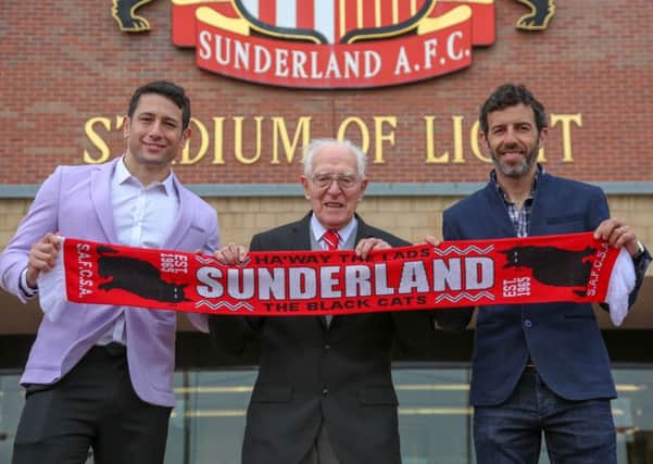 SAFC legend Julio Arca presents tickets for this month's FA Cup final  to veteran Sunderland fan George Forster. Also pictured is Johnny Escobar from Play Ojo. Picture by Tom Banks